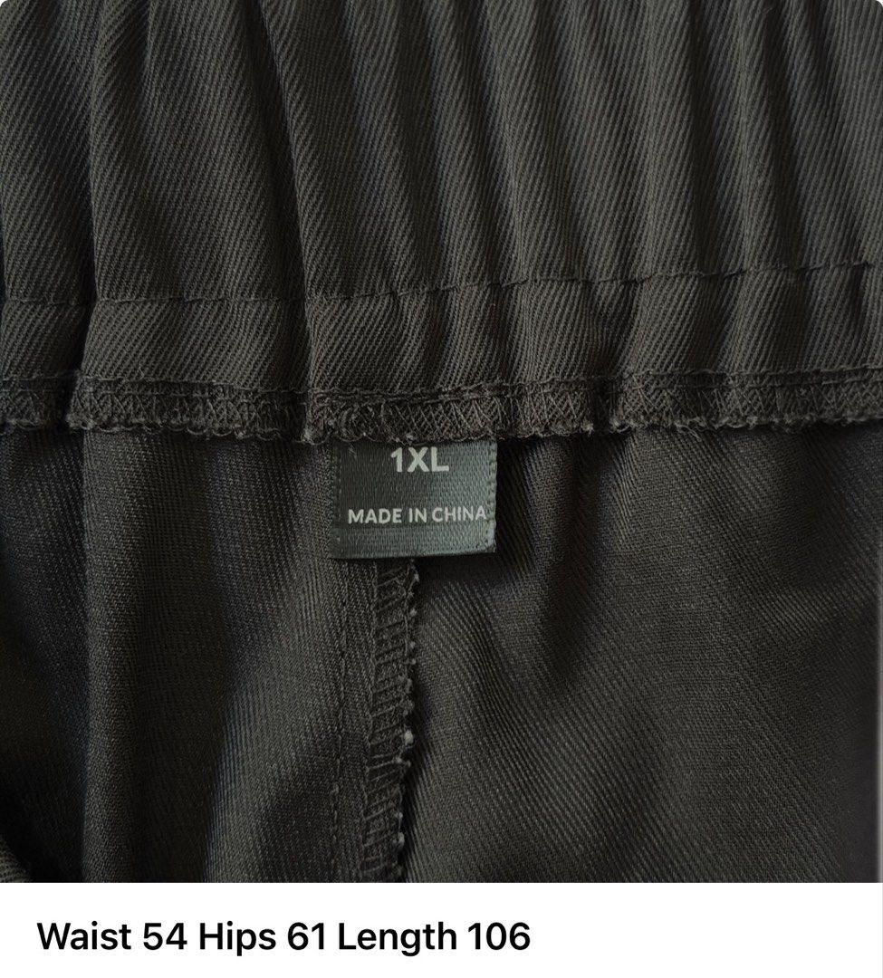 Plus Size Black Wide Leg Pants 1XL (Category: Other Bottoms) located in Cainta. Submitted by charkivesells (Listing ID 1434073088, Image 3). Description: - Black wide-leg pants - Size: 1XL - Features an elastic waistband - Measurements: - Waist: 54 - Hips: 61 - Length: 106 - Made in China - Smooth, possibly satin-like texture - Versatile for various occasions ⚠️ Dimensions in photos (in CM) MOP: gcash/maya/gotyme MOD: lalamove/ggx/j&t - ⚠️free de