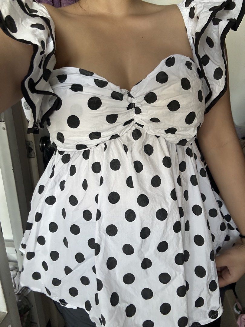 Polka Dot Babydoll Top (Category: Blouses) located in Manila. Submitted by cheatea (Listing ID 1434040073, Image 3). Description: - Off-shoulder design - Black polka dot print - Sweetheart neckline - Ruffled sleeves - Gathered bust detail - Lightweight fabric - Feminine and playful style - Ideal for warm weather.