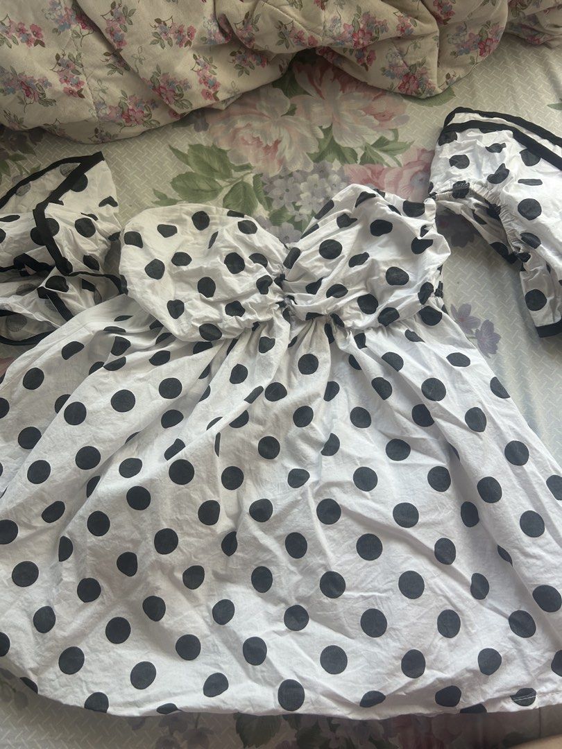Polka Dot Babydoll Top (Category: Blouses) located in Manila. Submitted by cheatea (Listing ID 1434040073, Image 1). Description: - Off-shoulder design - Black polka dot print - Sweetheart neckline - Ruffled sleeves - Gathered bust detail - Lightweight fabric - Feminine and playful style - Ideal for warm weather.