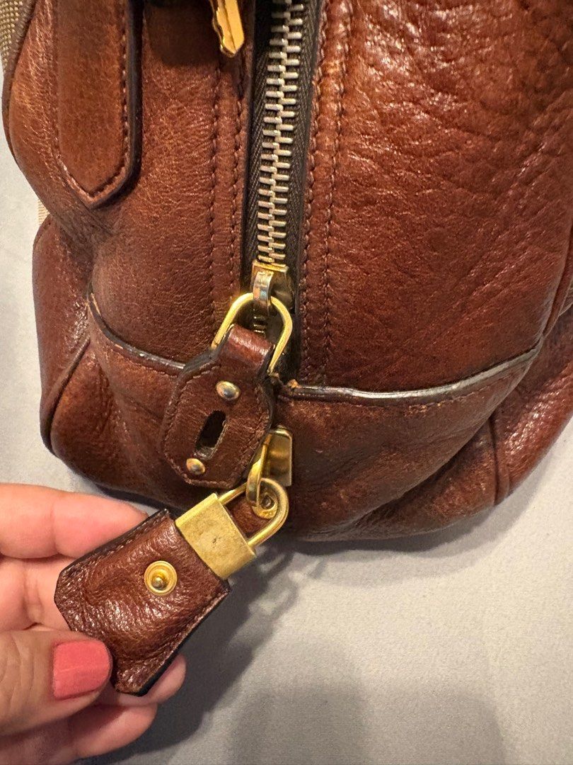 Prada (Category: Luxury Bags & Wallets) located in Manila. Submitted by carolynba49610 (Listing ID 1434153690, Image 3). Description: Authentic Prada; inclusions - dustbag, strap, cards, receipt, lock and key..
