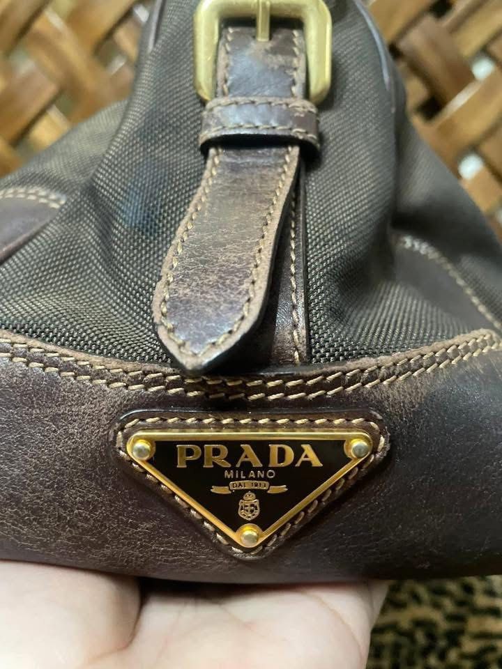 Prada 2 way bag (Category: Luxury Bags & Wallets) located in Quezon City. Submitted by itsmekriszzy (Listing ID 1434125501, Image 2). Description: RUSH SALE!!! 100% Authentic Prada Jacquard Logo Two Way Bag - Can be used as handbag or sling/crossbody bag. With signs of usage since it’s preloved. Manage your expectation. See detailed photos below. But guaranteed that this one super nice pa nya, very spacious and sturdy too! Bought in Japan. - Slig