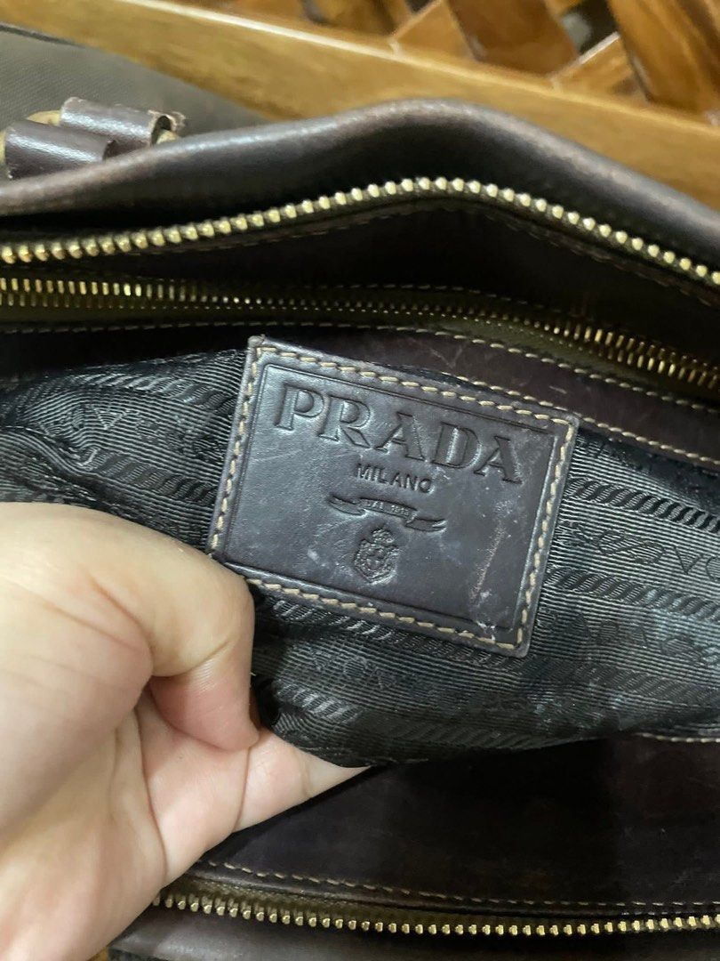 Prada 2 way bag (Category: Luxury Bags & Wallets) located in Quezon City. Submitted by itsmekriszzy (Listing ID 1434125501, Image 3). Description: RUSH SALE!!! 100% Authentic Prada Jacquard Logo Two Way Bag - Can be used as handbag or sling/crossbody bag. With signs of usage since it’s preloved. Manage your expectation. See detailed photos below. But guaranteed that this one super nice pa nya, very spacious and sturdy too! Bought in Japan. - Slig