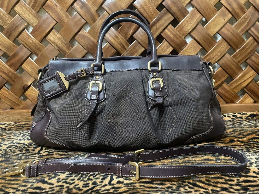 Prada 2 way bag (Category: Luxury Bags & Wallets) located in Quezon City. Submitted by itsmekriszzy (Listing ID 1434125501, Image 1). Description: RUSH SALE!!! 100% Authentic Prada Jacquard Logo Two Way Bag - Can be used as handbag or sling/crossbody bag. With signs of usage since it’s preloved. Manage your expectation. See detailed photos below. But guaranteed that this one super nice pa nya, very spacious and sturdy too! Bought in Japan. - Slig