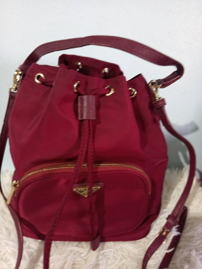 Prada Bucket Bag - maroon preloved (Category: Luxury Bags & Wallets) located in Gapan. Submitted by cristina_adofina (Listing ID 1434050740, Image 1). Description: preloved Prada lampo zip.Napakaganda in person .marron color with leather strap.thank you supermura na ..