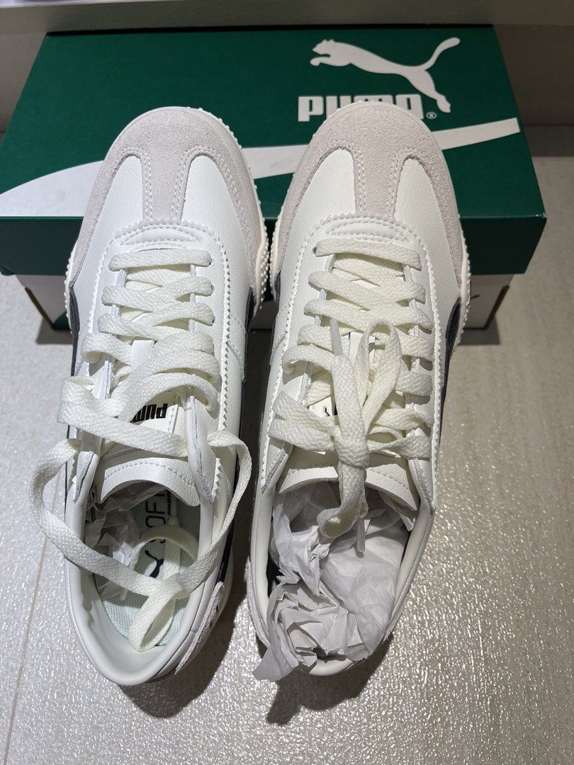Puma Bella UT LEA Warm White Sneakers (Category: Sneakers) located in Makati City. Submitted by anne2124 (Listing ID 1434101219, Image 2). Description: - Puma Bella UT LEA sneakers - Color: Warm white and black - Size: US Women's 8.5, UK 6, EUR 39 - Condition: New with original box - Sole: White with dotted pattern - Features: Suede toe cap, black Puma stripe Bnew never worn. Impulse buy. Bought in Puma at Parqal.