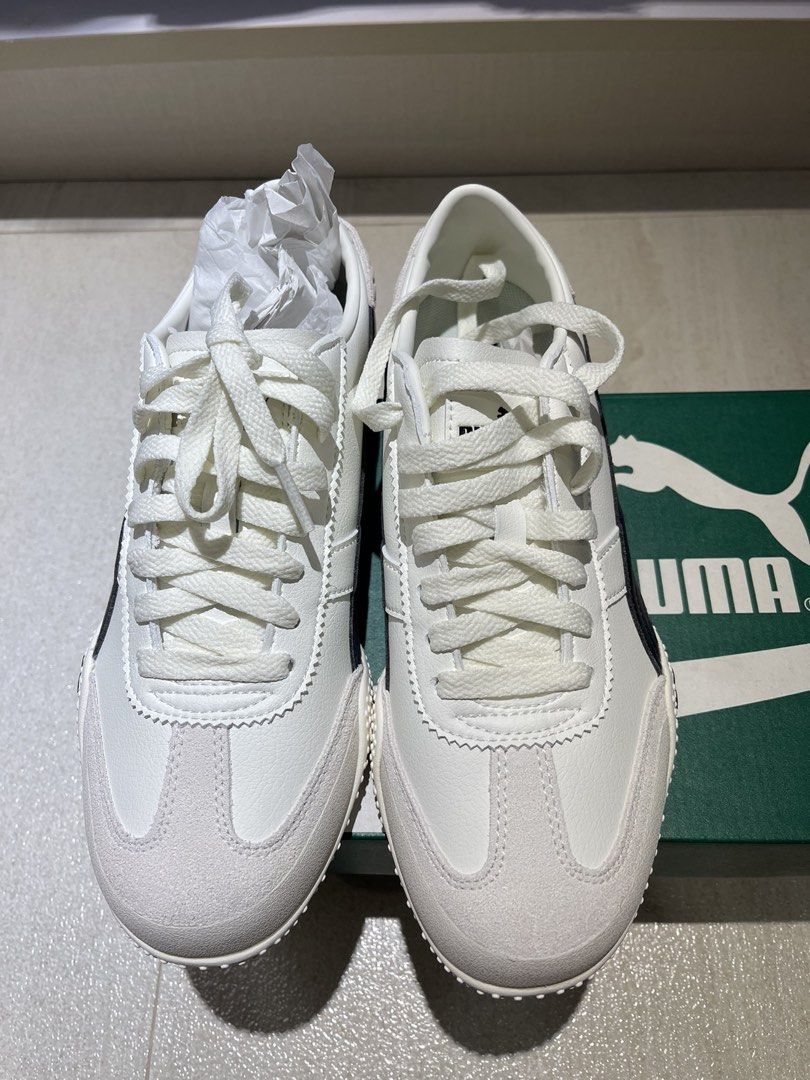 Puma Bella UT LEA Warm White Sneakers (Category: Sneakers) located in Makati City. Submitted by anne2124 (Listing ID 1434101219, Image 3). Description: - Puma Bella UT LEA sneakers - Color: Warm white and black - Size: US Women's 8.5, UK 6, EUR 39 - Condition: New with original box - Sole: White with dotted pattern - Features: Suede toe cap, black Puma stripe Bnew never worn. Impulse buy. Bought in Puma at Parqal.