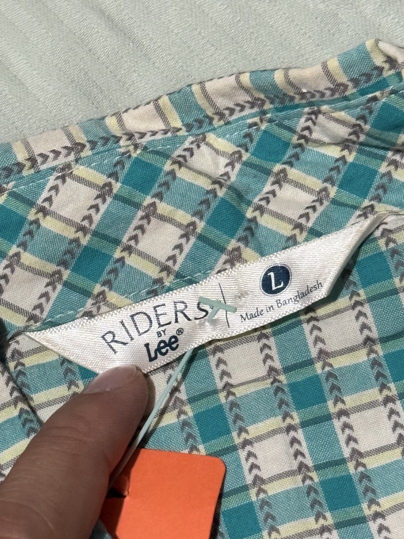 Riders by Lee Plaid Shirt - Large (Category: Tshirts & Polo Shirts ) located in Balanga. Submitted by julierms (Listing ID 1434089505, Image 3). Description: - Riders by Lee shirt - Size: Large - Color: Teal and white plaid - Features: Button-down front, collared neckline - Condition: New with tag - Made in Bangladesh.