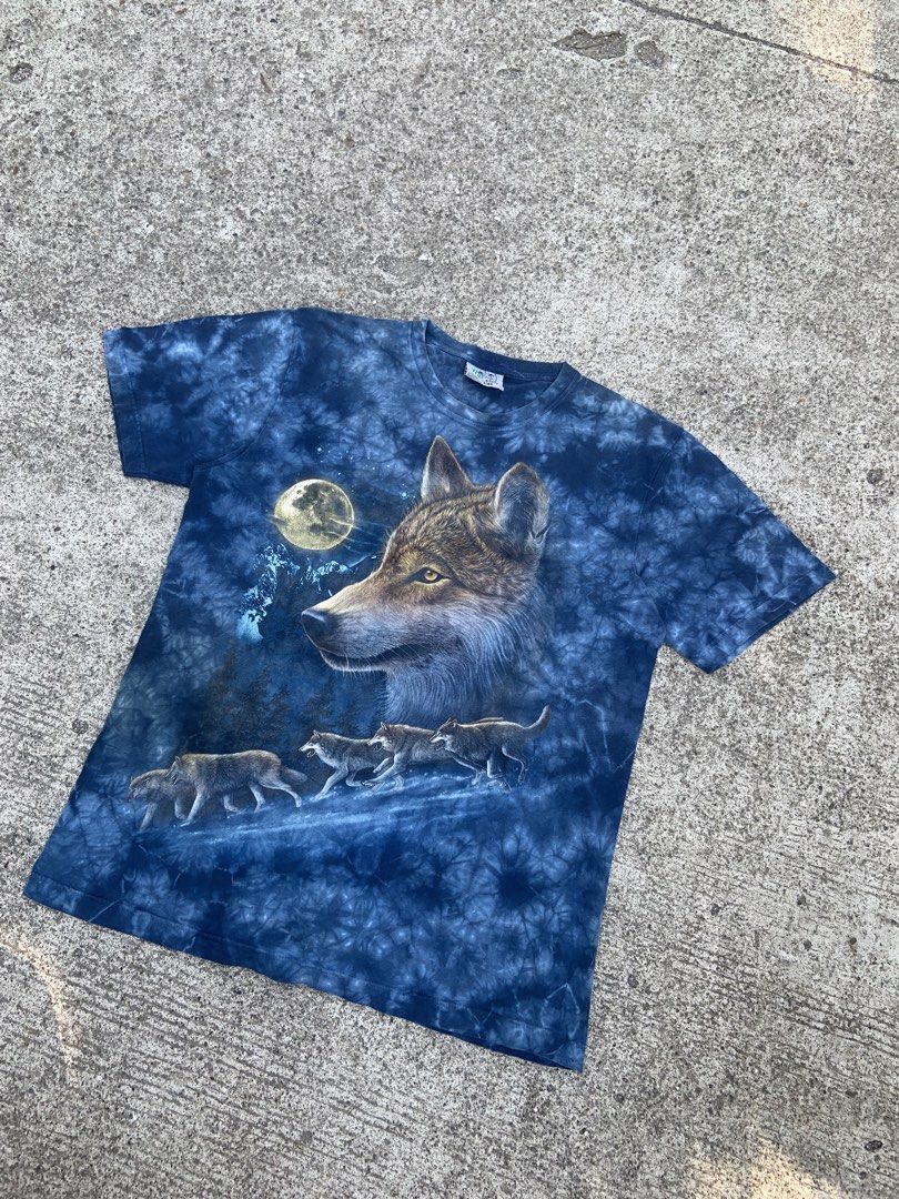 Rock Nature Wolf T-shirt (Category: Tshirts & Polo Shirts ) located in Manila. Submitted by thrift-ni-alas (Listing ID 1434084048, Image 1). Description: - Rock Nature t-shirt - Dimes 21.5x28.5 - Features a wolf design - Tie-dye blue background - Detailed image of a wolf and other wolves under a full moon - Standard crew neck - Tag is visible -Color rate 9 or better .