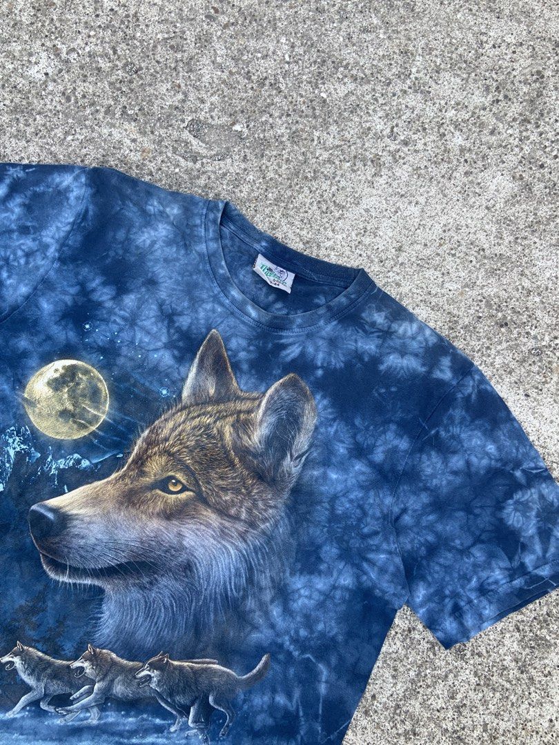 Rock Nature Wolf T-shirt (Category: Tshirts & Polo Shirts ) located in Manila. Submitted by thrift-ni-alas (Listing ID 1434084048, Image 2). Description: - Rock Nature t-shirt - Dimes 21.5x28.5 - Features a wolf design - Tie-dye blue background - Detailed image of a wolf and other wolves under a full moon - Standard crew neck - Tag is visible -Color rate 9 or better .
