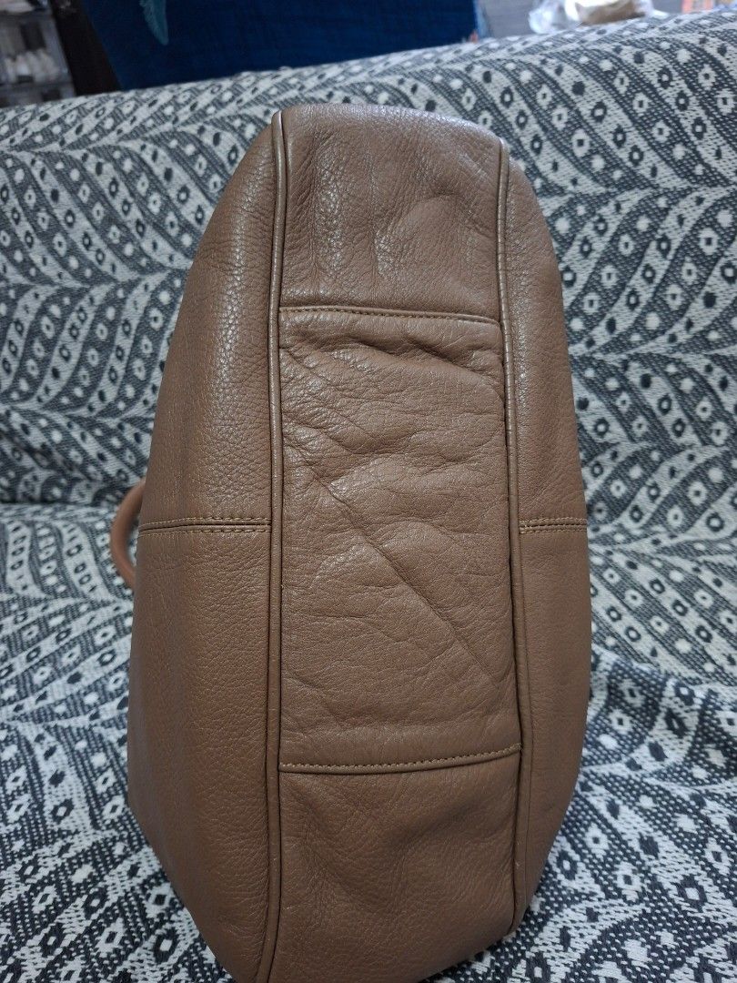 See by Chloe Leather Hobo Bag (Category: Luxury Bags & Wallets) located in Manila. Submitted by yanakolekzione (Listing ID 1434154494, Image 3). Description: - See by Chloé hobo bag - Brown leather exterior - Top handle design - Stylish tassel detail - Interior zippered pocket - Includes brand label - Minor wear on zipper pull - last photo is for reference only.