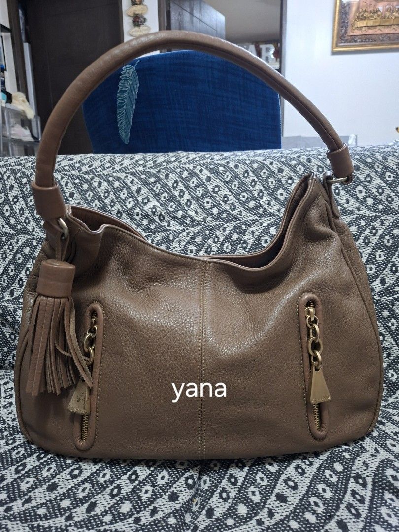 See by Chloe Leather Hobo Bag (Category: Luxury Bags & Wallets) located in Manila. Submitted by yanakolekzione (Listing ID 1434154494, Image 1). Description: - See by Chloé hobo bag - Brown leather exterior - Top handle design - Stylish tassel detail - Interior zippered pocket - Includes brand label - Minor wear on zipper pull - last photo is for reference only.