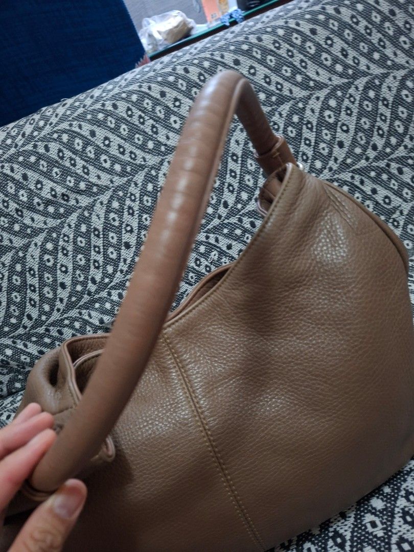 See by Chloe Leather Hobo Bag (Category: Luxury Bags & Wallets) located in Manila. Submitted by yanakolekzione (Listing ID 1434154494, Image 2). Description: - See by Chloé hobo bag - Brown leather exterior - Top handle design - Stylish tassel detail - Interior zippered pocket - Includes brand label - Minor wear on zipper pull - last photo is for reference only.