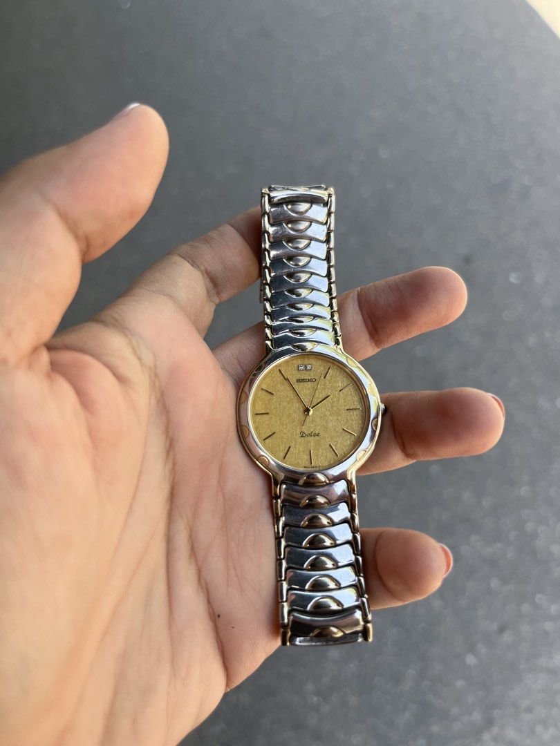 Seiko Dolce Gold Dial Watch (Category: Luxury Watches) located in Manila. Submitted by rosemaryclothing (Listing ID 1434021804, Image 1). Description: - Seiko Dolce watch - Gold dial - Two-tone silver and gold bracelet - Round face - Simple, classic design - Minor markings on the back - Suitable for everyday wear.
