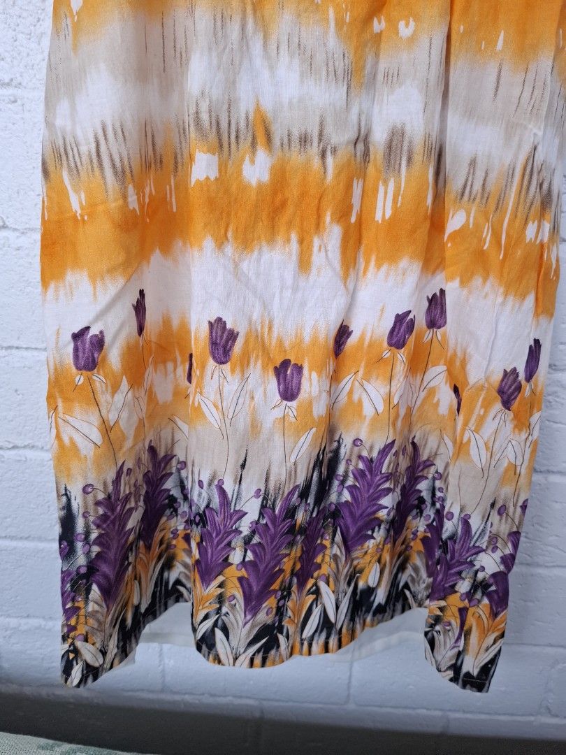 Shapes Dress - Orange and White (Category: Dresses) located in Pilar. Submitted by missteapot (Listing ID 1434054882, Image 3). Description: - Brand: Sophias - Features a vibrant orange and white pattern with purple accents. - Sleeveless design. - Zipper closure. - Includes a white inner lining. - Made of lightweight material..