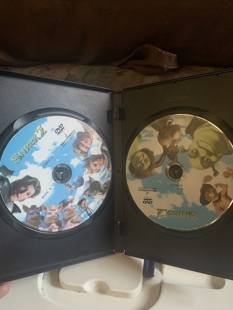 Shrek 2 DVD (Category: CDs & DVDs) located in Valenzuela. Submitted by moonlightperks (Listing ID 1434054480, Image 3). Description: Shrek 2 DVD. Includes two discs. Features bonus content such as a 3D bonus disc, trailers, and more. Subtitles available in English, Thai, Mandarin, and other languages. Includes a "Far Far Away Idol" bonus feature..