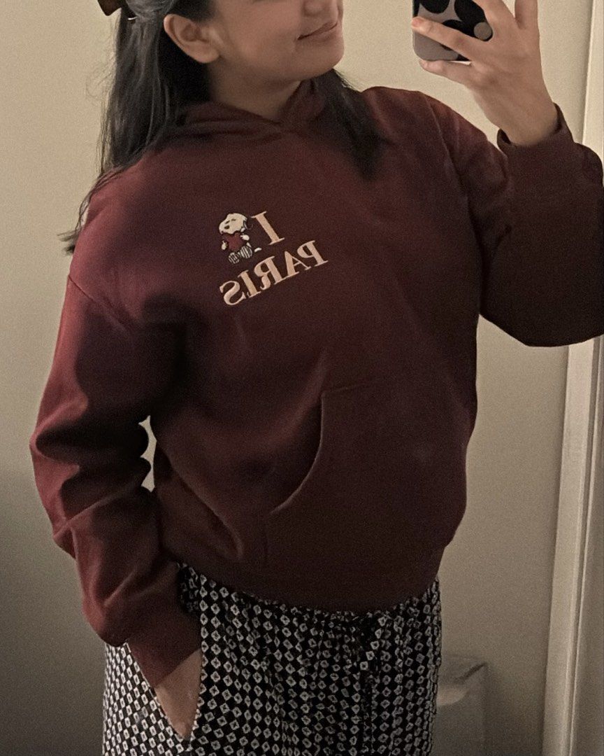 Snoopy I Love Paris Hoodie (Category: Longsleeves) located in Manila. Submitted by 18.06_ds (Listing ID 1434090967, Image 2). Description: - Maroon hoodie - Features "I Paris" phrase with Snoopy graphic - Kangaroo pocket - Hooded - Soft material - Ribbed cuffs on sleeves - Casual and comfortable design.