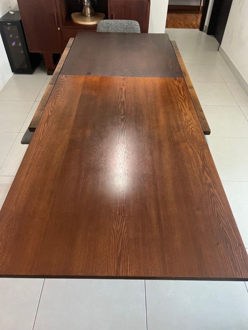 Solid Wooden Dining Table - Extendable (Category: Tables & Sets) located in Singapore. Submitted by etlas (Listing ID 1434077938, Image 2). Description: Beautiful Solid Wood Table, 1m wide, 1.4m long. 2.4m when extended. Extension mechanism carved within the table without metal parts. This makes it more durable and easy to operate. Perfect for family meals and entertaining.