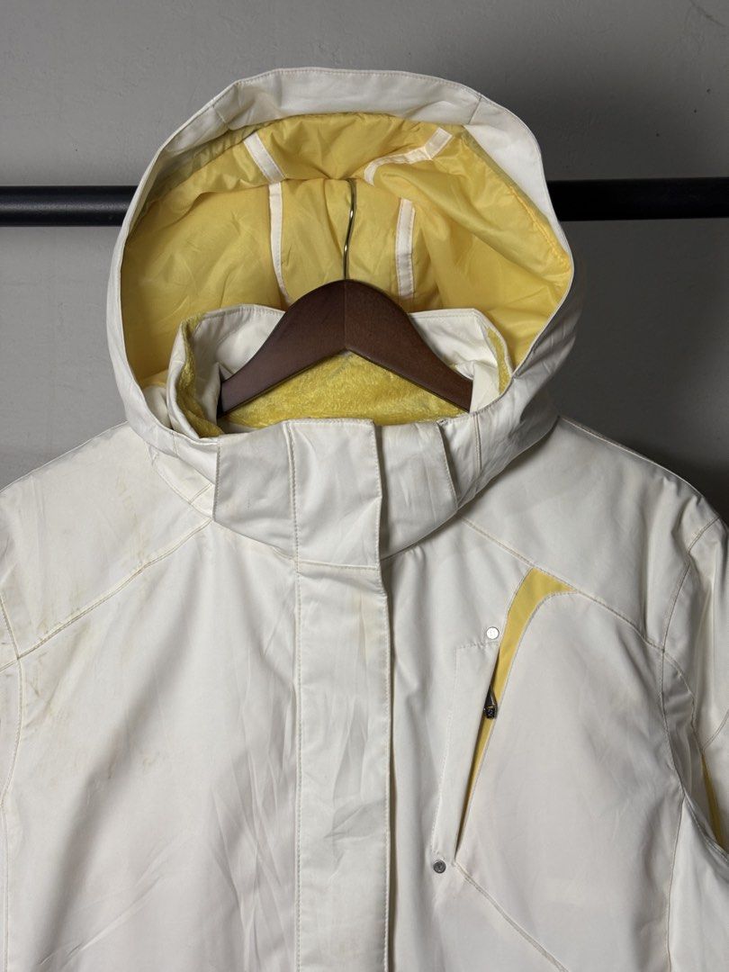 Spyder White and Yellow Ski Jacket (Category: Coats, Jackets and Outerwear) located in Manila. Submitted by angelll444 (Listing ID 1434053666, Image 2). Description: - Spyder ski jacket - Color: White with yellow accents - Size: L (22x28 dimes) - Features: - Hood - Multiple pockets - Thinsulate insulation - Interior: Yellow - Made in Vietnam - Spyder logo on front and back - Includes attached tag.