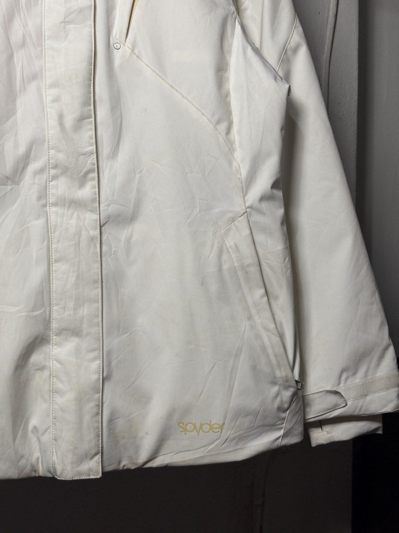 Spyder White and Yellow Ski Jacket (Category: Coats, Jackets and Outerwear) located in Manila. Submitted by angelll444 (Listing ID 1434053666, Image 3). Description: - Spyder ski jacket - Color: White with yellow accents - Size: L (22x28 dimes) - Features: - Hood - Multiple pockets - Thinsulate insulation - Interior: Yellow - Made in Vietnam - Spyder logo on front and back - Includes attached tag.