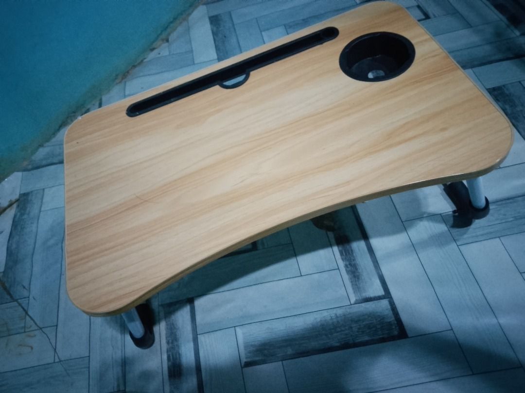 Study table (Category: Tables & Sets) located in Manila. Submitted by jonathx (Listing ID 1434095085, Image 1). Description: Portable study table. Features a cup holder and tablet slot. Foldable legs for easy storage. Light wood finish..