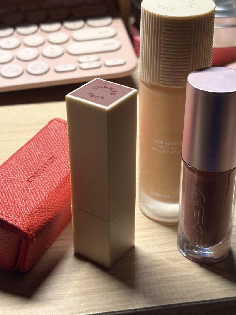 Sunnies Face + ISSY makeup set (Category: Makeup) located in Manila. Submitted by angelicb__01 (Listing ID 1434132049, Image 2). Description: 1-3 swatches only - Sunnies Face Base Booster in shade 02: Multi-use tinted illuminator. - Sunnies Face Glidegloss in shade Major: Plumping glow gloss. - Issy Fatgloss in cowgirl - Lipstick with a red case. Only doing same day delivery within MM.