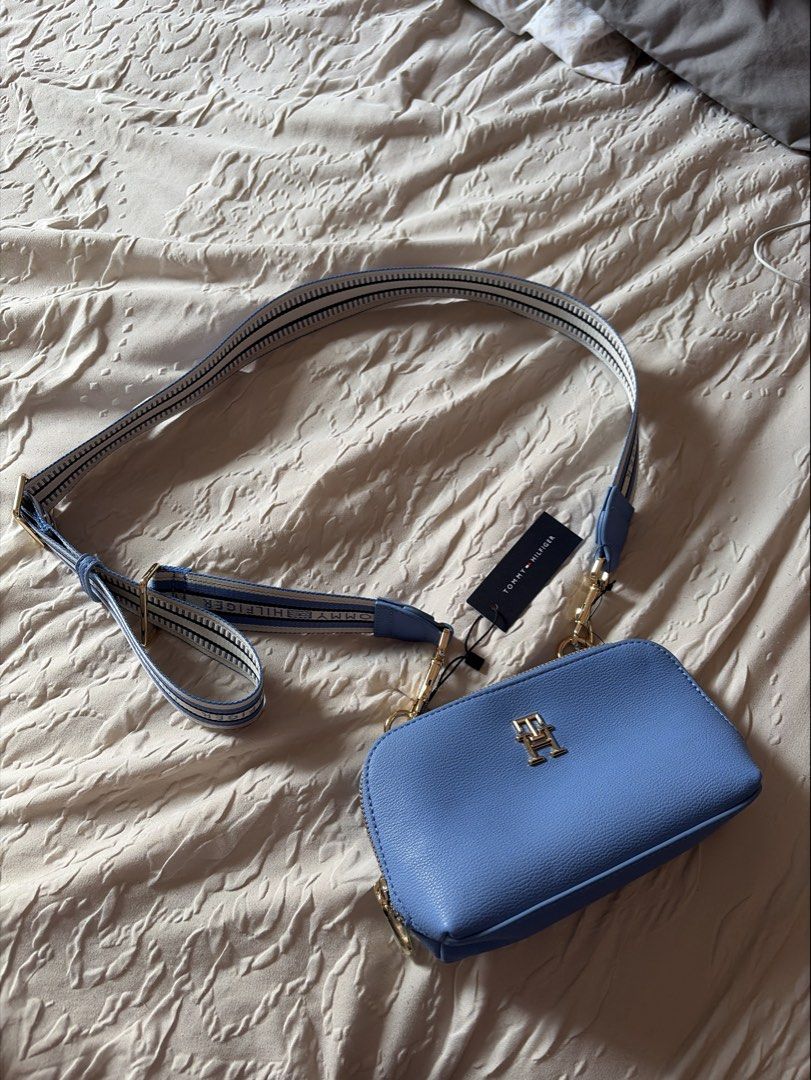 Tommy Hilfiger Crossbody Bag (Category: Cross-body Bags) located in Davao. Submitted by _casells (Listing ID 1433996696, Image 1). Description: **Tommy Hilfiger Blue Crossbody Bag (Brand New w/ Tags)** 💙 Authentic Tommy Hilfiger mini crossbody / camera bag 💙 Brand new with tag (never used) 💙 Color: Light blue 💙 Gold-tone hardware with TH logo 💙 Adjustable logotape strap (can be worn crossbody or shoulder) 💙 Zip closure, compact but fits ess
