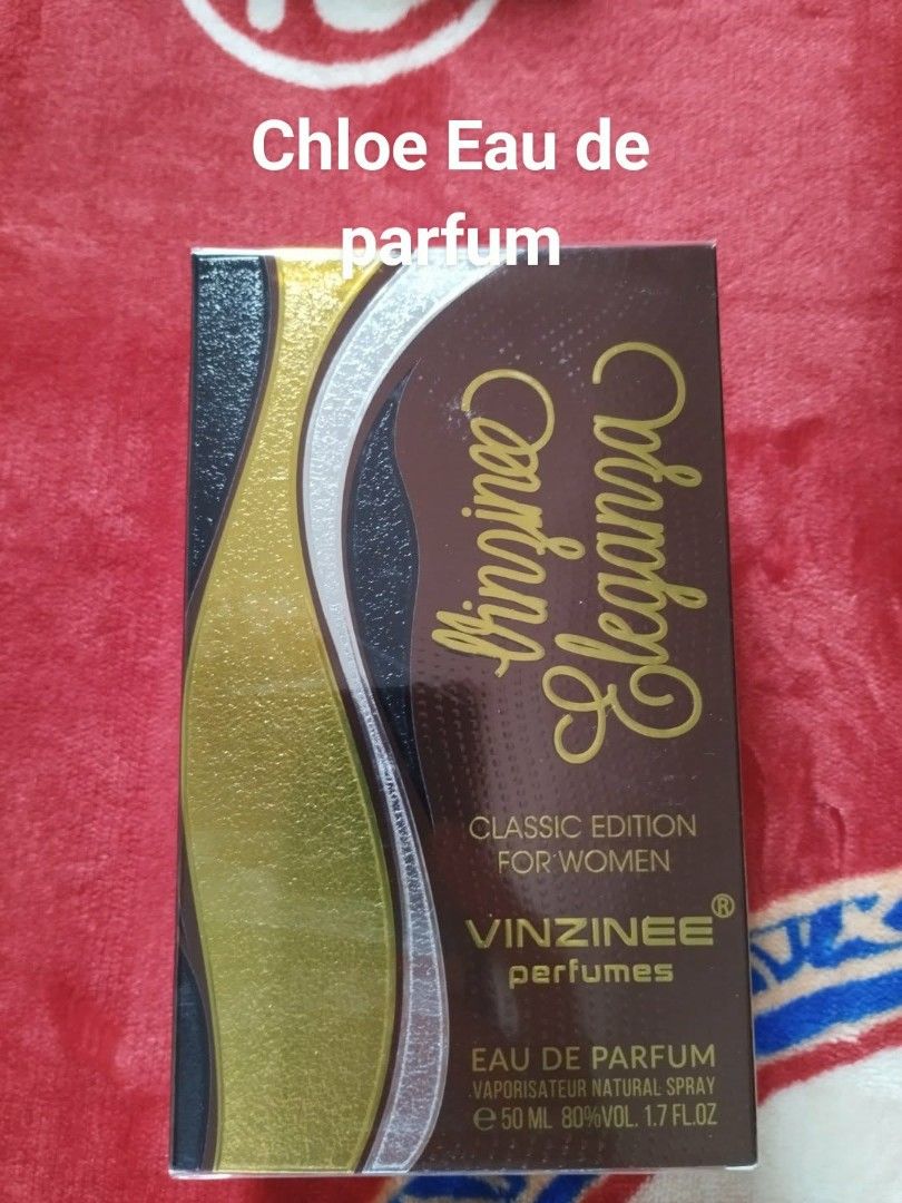 Vinzinee Eleganza Eau de Parfum (Category: Fragrance & Deodorants) located in General Mariano Alvarez. Submitted by deslacbayan (Listing ID 1434040882, Image 1). Description: - Vinzinee Eleganza Eau de Parfum (Classic Edition) for women. - 50ml bottle. - Natural spray. - 80% vol, 1.7 fl oz. - Elegant brown, gold, and silver box design..