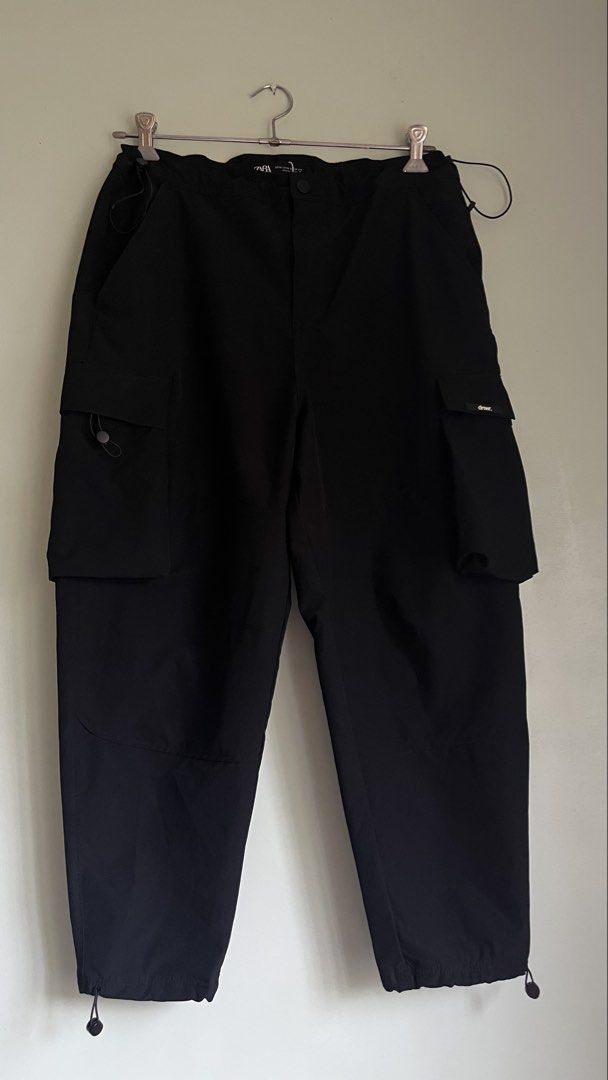 Zara Black Cargo Pants XL (Category: Jeans) located in Pasig City. Submitted by detneedsmoney (Listing ID 1434036475, Image 1). Description: - Zara black cargo pants - Size: XL - Features: Multiple pockets, adjustable waist and ankles - Fit: Relaxed.