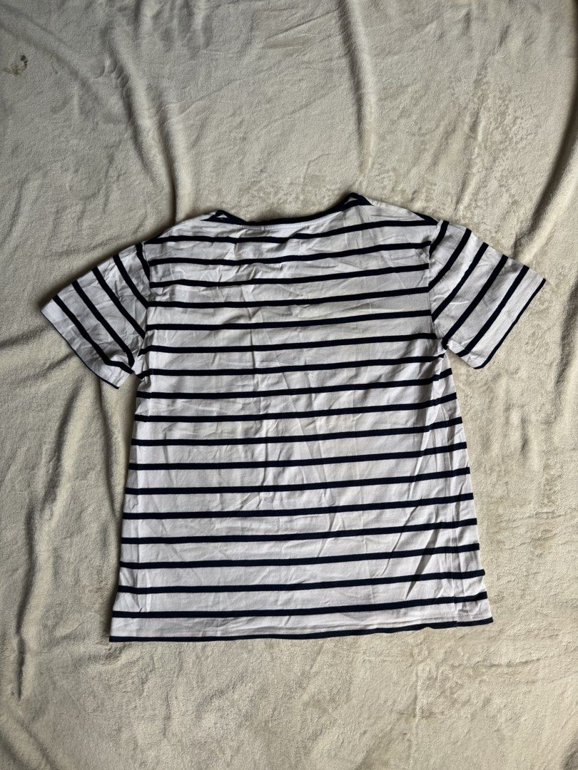 Acne Studios Striped T-shirt (Category: Tshirts & Polo Shirts ) located in Manila. Submitted by ffranzledesma (Listing ID 1434271818, Image 3). Description: - Acne Studios striped t-shirt - Color: White and navy blue - Features a classic crew neck - Short sleeves - Acne Studios logo detail on neckline - Small logo patch on front - Horizontal stripes throughout Description: size M Dimes: L - 26 in W - 20 in MOP: Gcash or Maya MOD: Lalamove or J&T.
