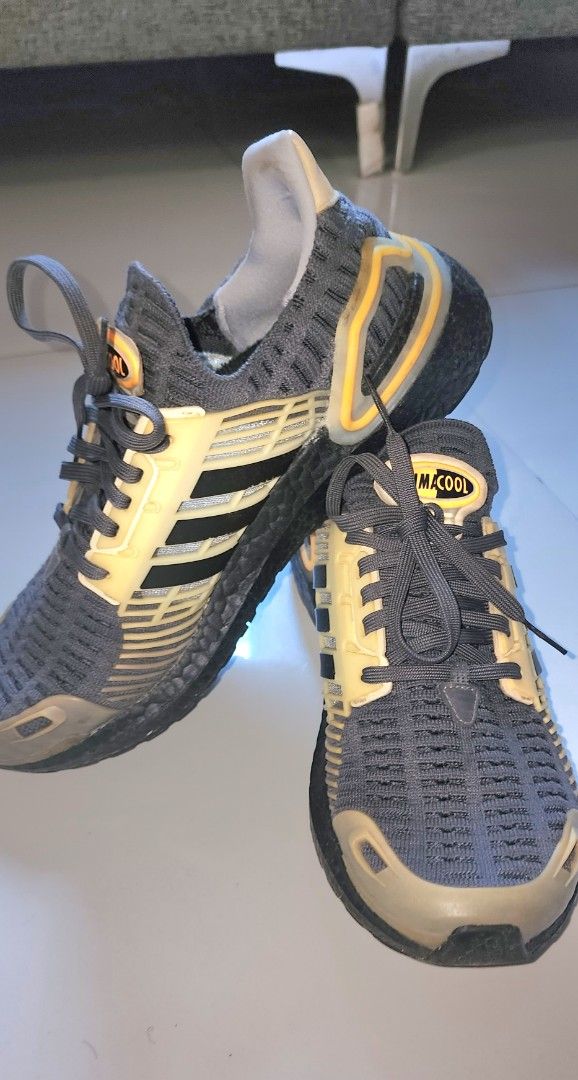 Adidas Climacool Sneakers (Category: Sneakers) located in Imus. Submitted by sashafame (Listing ID 1434291847, Image 1). Description: - Adidas Climacool sneakers - Color: Grey and yellow - Adidas stripes detail - Black soles with orange accents - Climacool logo on the tongue.