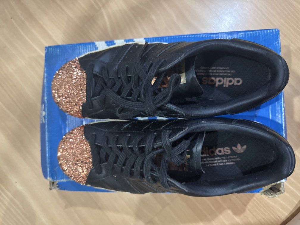 Adidas Superstar Black (Category: Sneakers) located in Las Pinas. Submitted by pachdeclutters (Listing ID 1434319114, Image 1). Description: Adidas Superstar 80s Metal Toe - Rare - US 8.5 - comes with box but with handwritten marker - Guaranteed Authentic as bought in Adidas Store in HK.