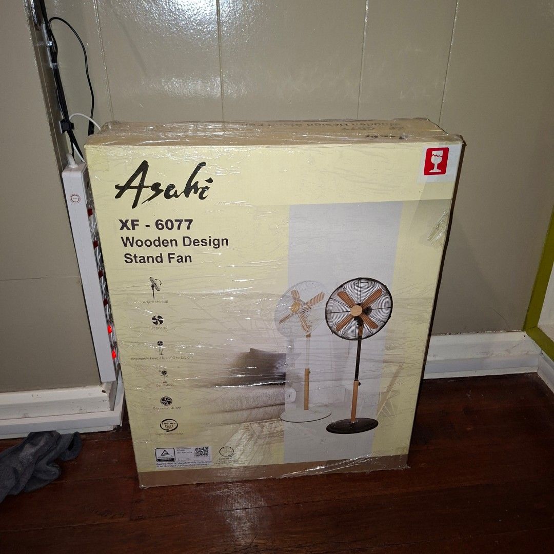 Asahi XF-6077 Wooden Design Stand Fan (Category: Fans) located in Pasig City. Submitted by mr.bargaindeal (Listing ID 1434231663, Image 1). Description: - Brand new Asahi XF-6077 stand fan - Elegant black and wood color scheme - Stand fan design - Ideal for home or office use - Unopened and sealed unit.