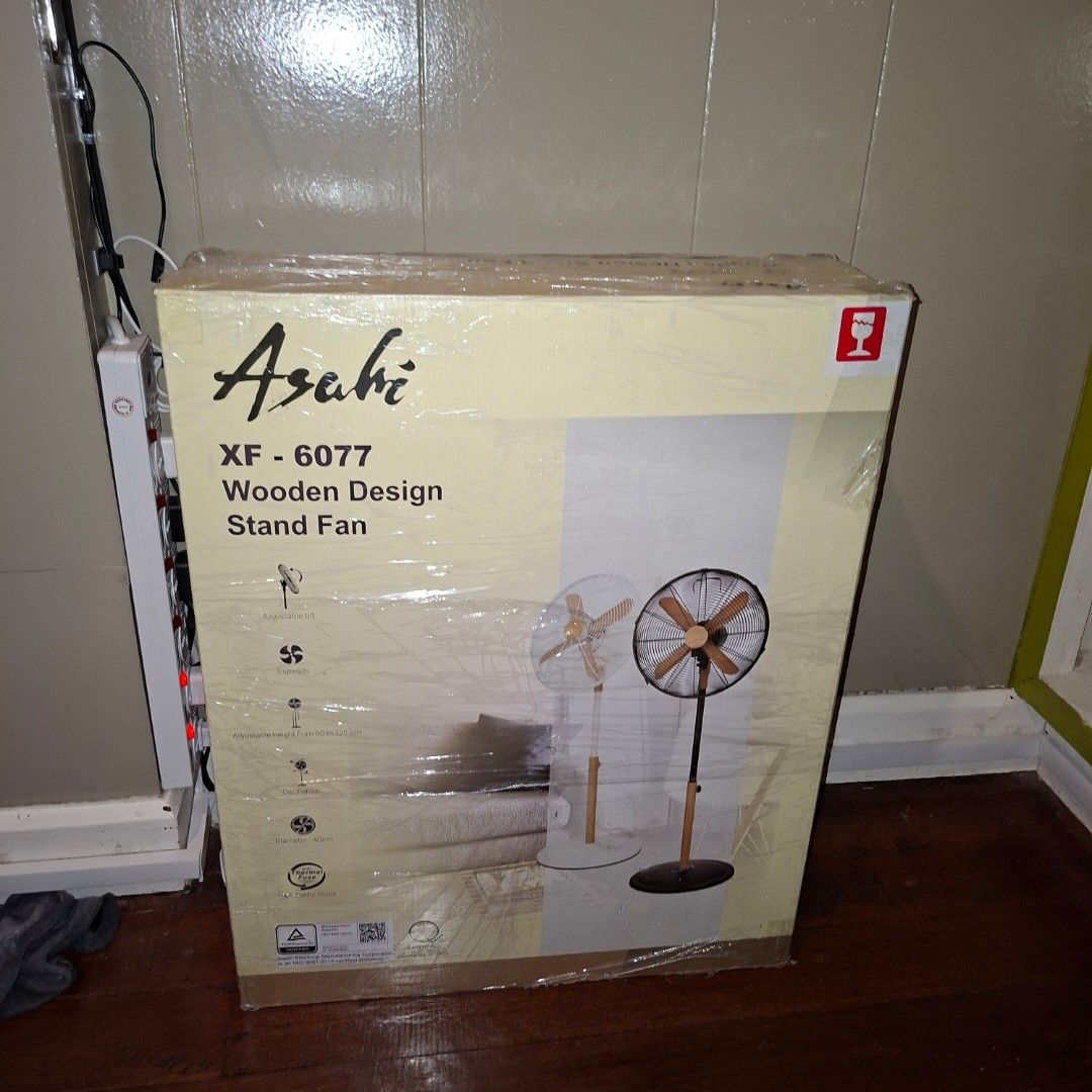 Asahi XF-6077 Wooden Design Stand Fan (Category: Fans) located in Pasig City. Submitted by mr.bargaindeal (Listing ID 1434231663, Image 2). Description: - Brand new Asahi XF-6077 stand fan - Elegant black and wood color scheme - Stand fan design - Ideal for home or office use - Unopened and sealed unit.