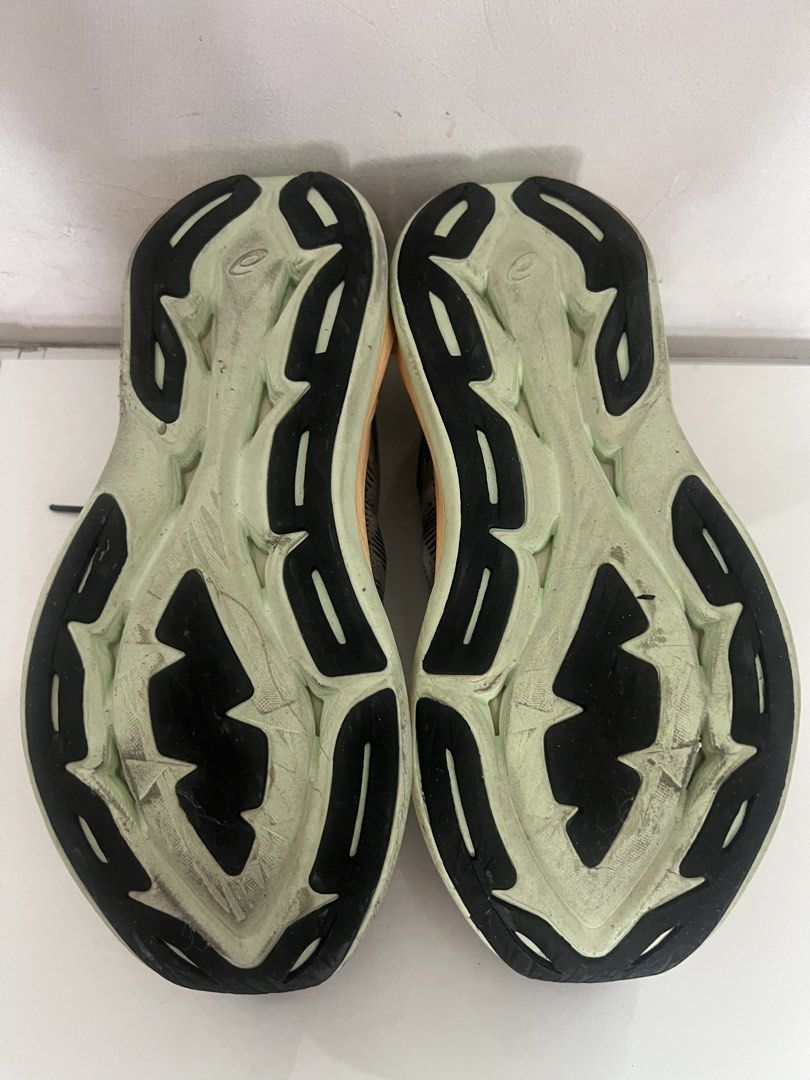 Asics Superblast Running Shoes - US 9.5 (Category: Sneakers) located in Singapore. Submitted by luckyfish_888 (Listing ID 1434232883, Image 3). Description: - Asics Metaspeed Sky running shoes - Color: Grey and orange - Size: US 9.5 - Visible wear on soles.
