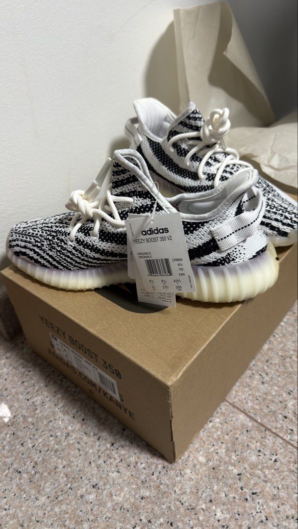 Authentic Adidas Yeezy Boost 350 V2 Zebra - US 9 (Category: Sneakers) located in Singapore. Submitted by glowing.skin (Listing ID 1434322917, Image 3). Description: - Adidas Yeezy Boost 350 V2 Zebra - Size: US 9 - Condition: Brand new, never worn - Includes original box, tags, and receipt - Perfect condition - Ready to ship.