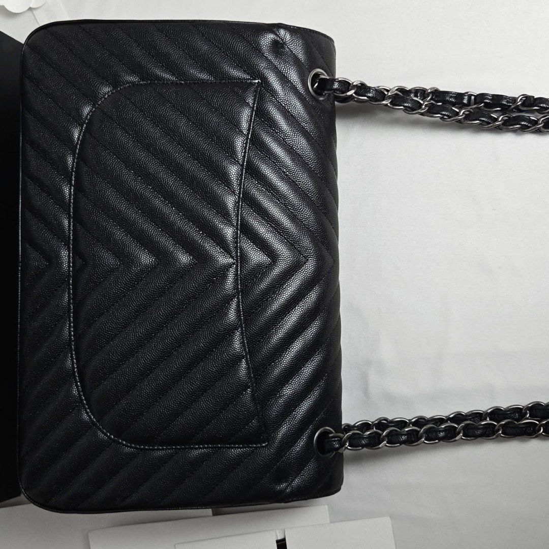 Authentic Chanel Classic Large Caviar (Category: Luxury Bags & Wallets) located in Quezon City. Submitted by jhaediah (Listing ID 1431566256, Image 2). Description: classic large caviar ♥️4.25 metalic black card recipt classic paper booklet box Excellent Free pabitbit Korea- fully paid before paship sa pinas .
