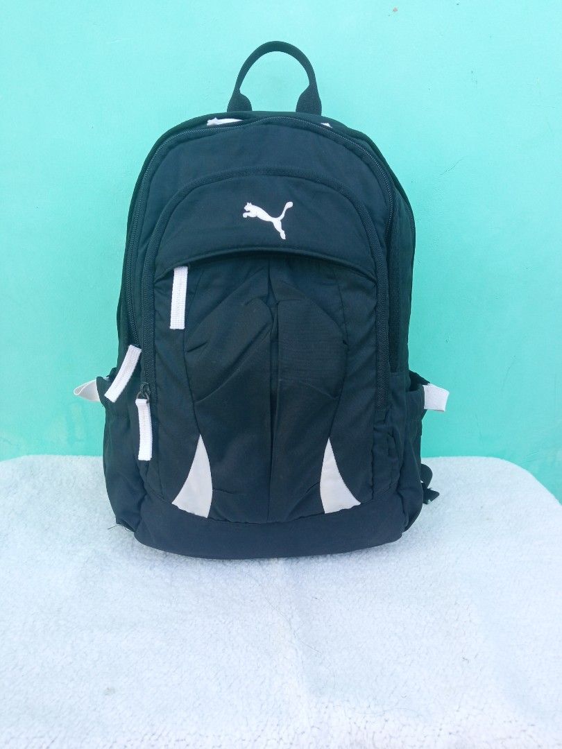 Authentic PUMA Black Unisex Small Backpack from SOUTH KOREA (Category: Backpacks) located in Batangas. Submitted by buddy_and_willow (Listing ID 1434381116, Image 1). Description: ‼️PLEASE READ FULL DESCRIPTION and SEE ALL PHOTOS‼️ Preloved from South Korea Color: Black Authentic PUMA No flaws, signs of usage only 4 compartments with 2 garterized side pockets Padded back and straps With etiketa and hologram linings inside 📍LOCATION: LIPA, BATANG