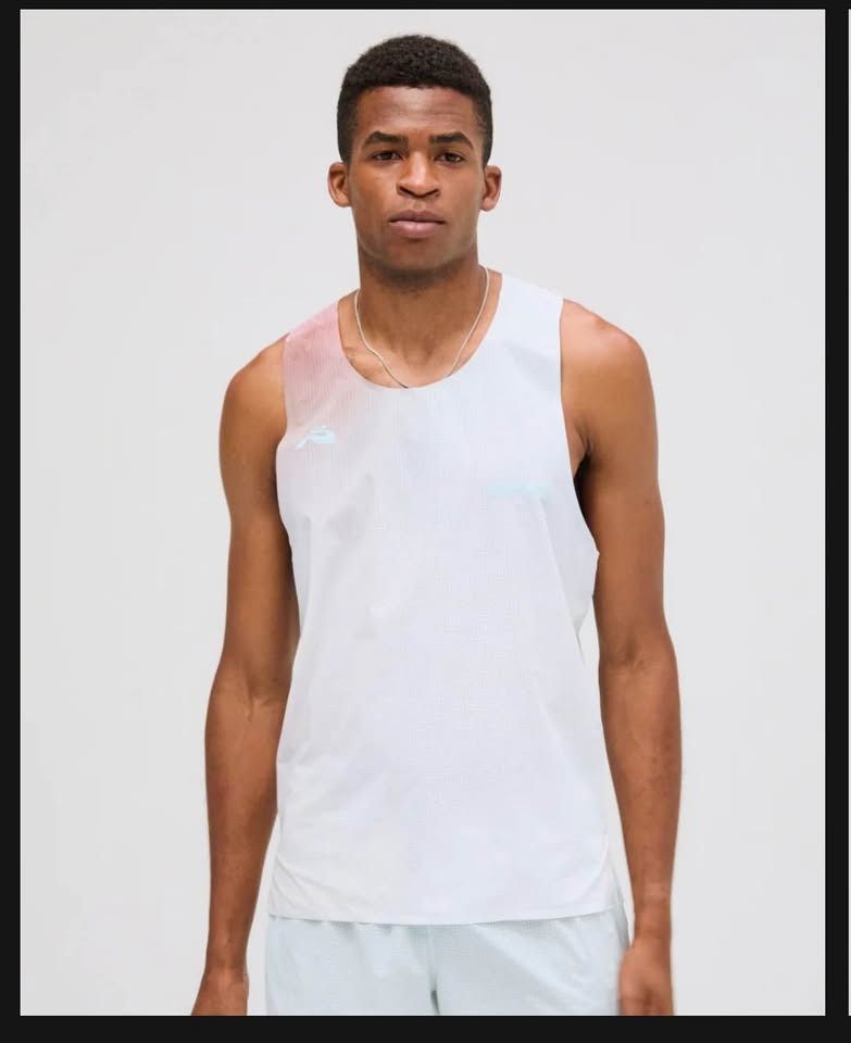 Bandit Running Tank Top - Vento Singlet Striated - Medium (Category: Activewear) located in Manila. Submitted by lumenos (Listing ID 1434377711, Image 3). Description: Bandit running singlet Size Medium Brand new Rfs- wrong size Pm me if interested QC area - White running tank top - Features a red "BANDIT" vertical stripe - Racerback design - Made from breathable and lightweight material - Ideal for running and athletic activities .