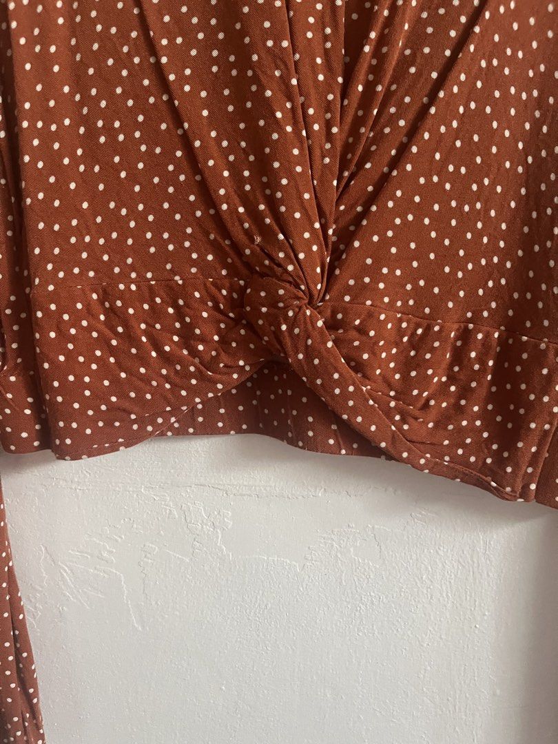 Bershka Polka Dot Blouse (Category: Blouses) located in Mandaluyong City. Submitted by declutterrie (Listing ID 1434331875, Image 3). Description: - Bershka blouse - Unique twist-front design - Long sleeves with flared cuffs - Fits S to M - Back features three buttons - Size: EUR/XS.