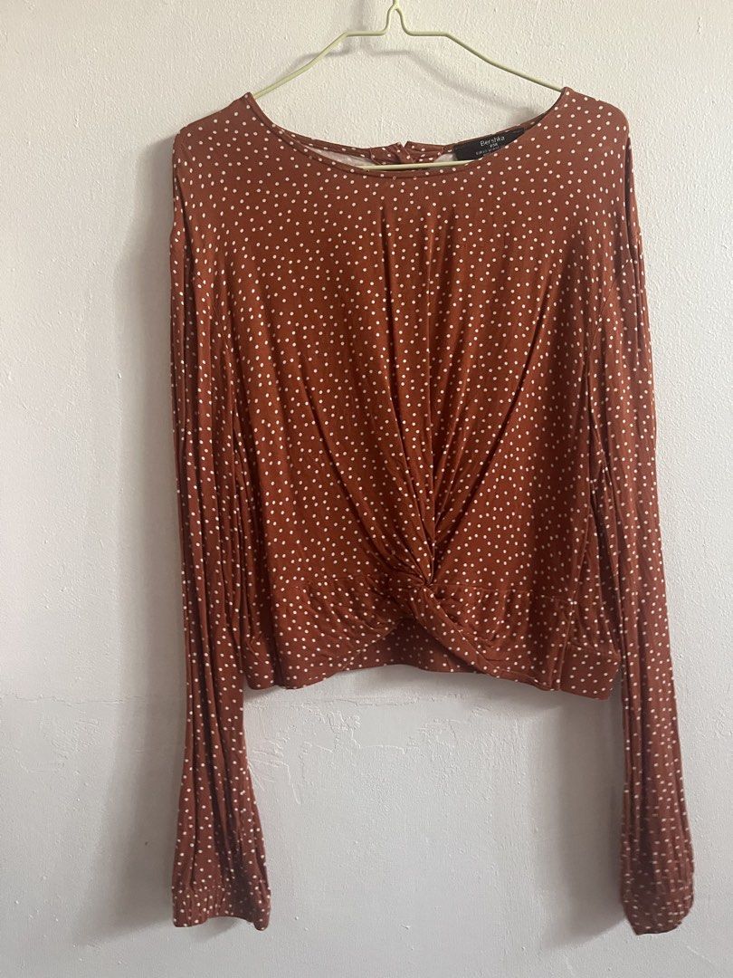 Bershka Polka Dot Blouse (Category: Blouses) located in Mandaluyong City. Submitted by declutterrie (Listing ID 1434331875, Image 2). Description: - Bershka blouse - Unique twist-front design - Long sleeves with flared cuffs - Fits S to M - Back features three buttons - Size: EUR/XS.