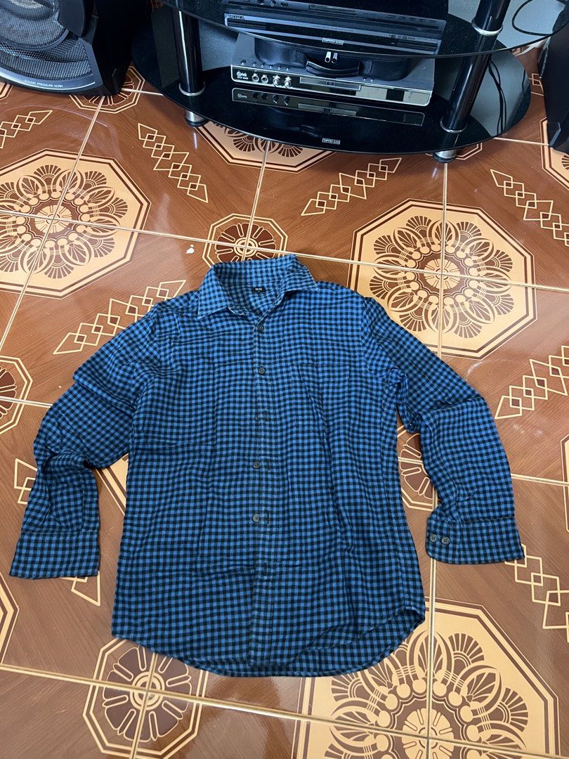 Blue Checkered Long Sleeve Shirt (Category: Tshirts & Polo Shirts ) located in Manila. Submitted by mark_decluttering (Listing ID 1434215709, Image 1). Description: - Blue checkered long-sleeved shirt - Button-down front and cuffs - Comfortable fabric - Collared neckline - Standard fit - Ready to wear.