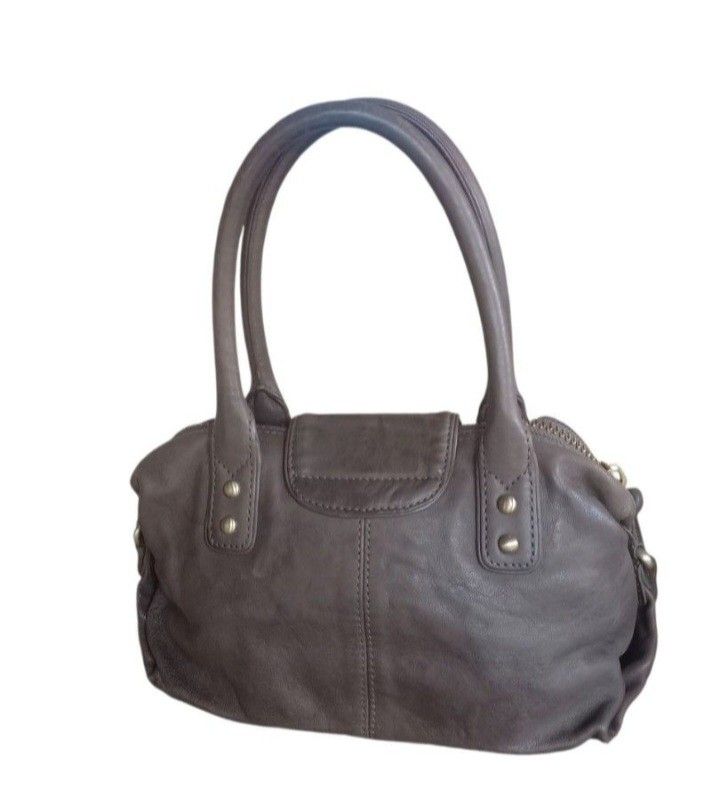 Botkier Leather Handbag (Category: Luxury Bags & Wallets) located in Lamut. Submitted by sakosack (Listing ID 1434336086, Image 2). Description: - Botkier handbag - Brown leather exterior - Gold-tone hardware - Two front pockets - Top handle - Zipper closure - Fabric interior - Brand name visible - Made in Indonesia.