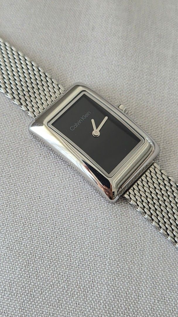 Calvin Klein Rectangular Mesh Watch (Category: Women's Watches) located in Quezon City. Submitted by mooneon (Listing ID 1434224327, Image 1). Description: - Calvin Klein watch - Rectangular black dial - Silver mesh strap - Minimalist design - Includes original box and tag - Calvin Klein logo on clasp -used once. like new cartier, calvin klein, minimalist watch, vintage watch design.