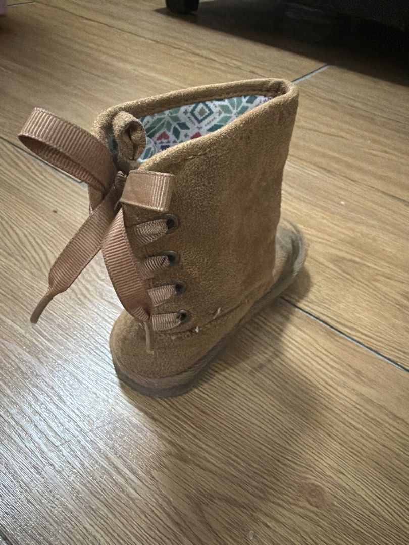 Carter's Toddler Boots Size 7 (Category: Babies & Kids Fashion) located in San Fernando. Submitted by naomigfran (Listing ID 1434195758, Image 2). Description: Adorable Carter's toddler boots in a warm brown color. Features a soft suede-like exterior and a patterned interior lining. The boots have a lace-up detail on the side and a pull tab at the back for easy wear. Size 7 US, 23 EUR, and 14 CM. Perfect for keeping little feet warm and stylish..