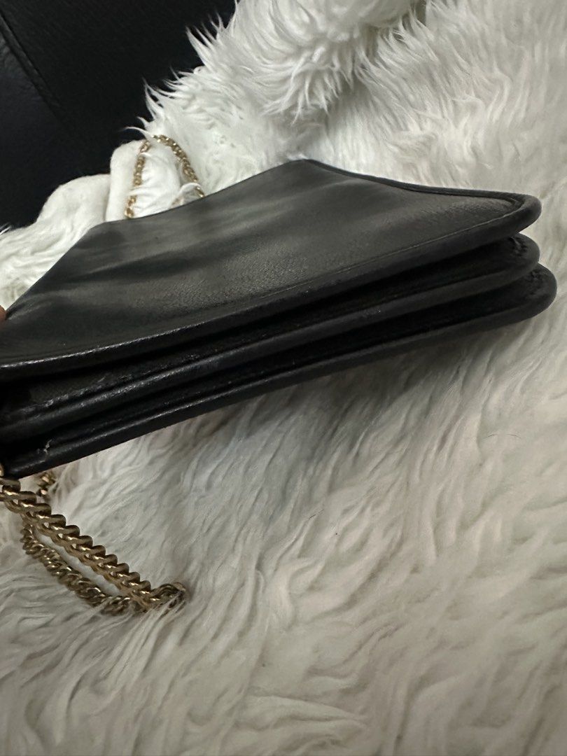 Christian Dior Black Shoulder Bag (Category: Luxury Bags & Wallets) located in Marilao. Submitted by curleylux (Listing ID 1434200866, Image 3). Description: - Christian Dior shoulder bag in black - Elegant gold chain strap - Gold-tone clasp with Dior logo - Interior lined with Dior monogram pattern - Made in France - Multiple compartments for organization.