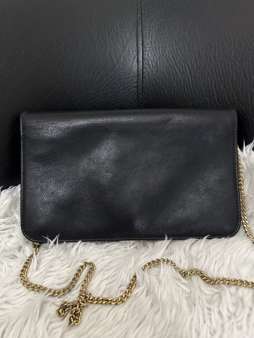 Christian Dior Black Shoulder Bag (Category: Luxury Bags & Wallets) located in Marilao. Submitted by curleylux (Listing ID 1434200866, Image 2). Description: - Christian Dior shoulder bag in black - Elegant gold chain strap - Gold-tone clasp with Dior logo - Interior lined with Dior monogram pattern - Made in France - Multiple compartments for organization.