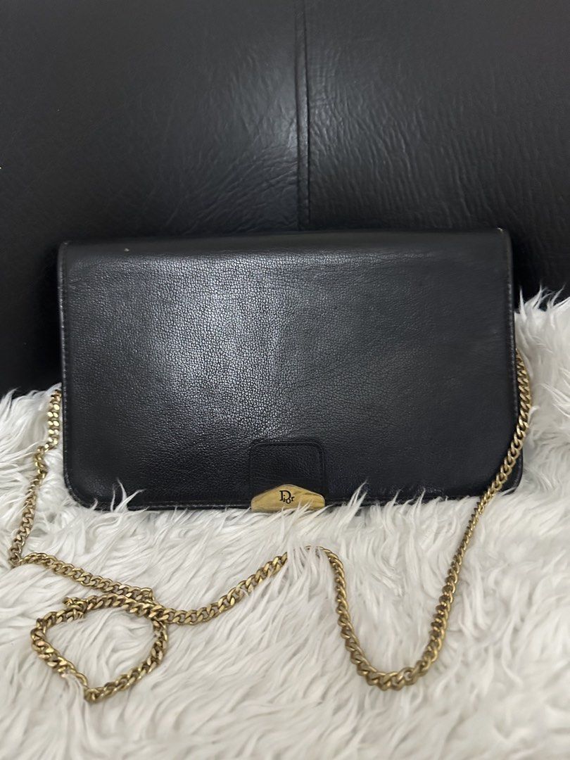 Christian Dior Black Shoulder Bag (Category: Luxury Bags & Wallets) located in Marilao. Submitted by curleylux (Listing ID 1434200866, Image 1). Description: - Christian Dior shoulder bag in black - Elegant gold chain strap - Gold-tone clasp with Dior logo - Interior lined with Dior monogram pattern - Made in France - Multiple compartments for organization.