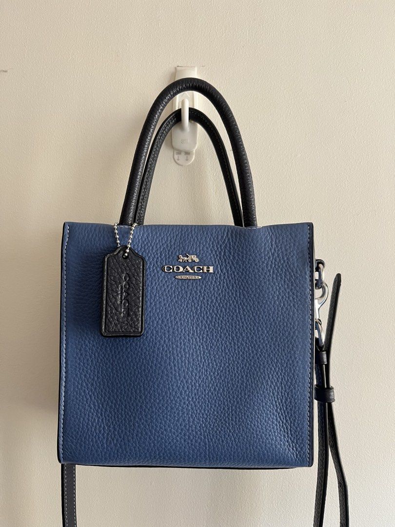 Coach Mini Cally Tote in Sky Blue Multi (Category: Luxury Bags & Wallets) located in Bacoor. Submitted by 2nds.pop (Listing ID 1434309422, Image 1). Description: Authentic original Please zoom in on photos to manage expectations. Hardware has coach logo Strap is too long for me so i added extra holes to make it shorter. .