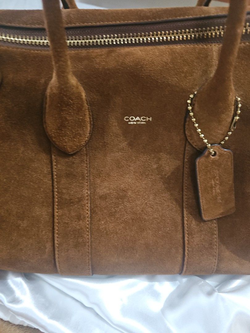Coach Suede Compass 35 (Category: Luxury Bags & Wallets) located in Quezon City. Submitted by jaygee (Listing ID 1424573728, Image 2). Description: Authentic Coach Compass 35 Brown Suede With cards and dust bag Purchased in the US in Nov 2025 Retail store not outlet bag.