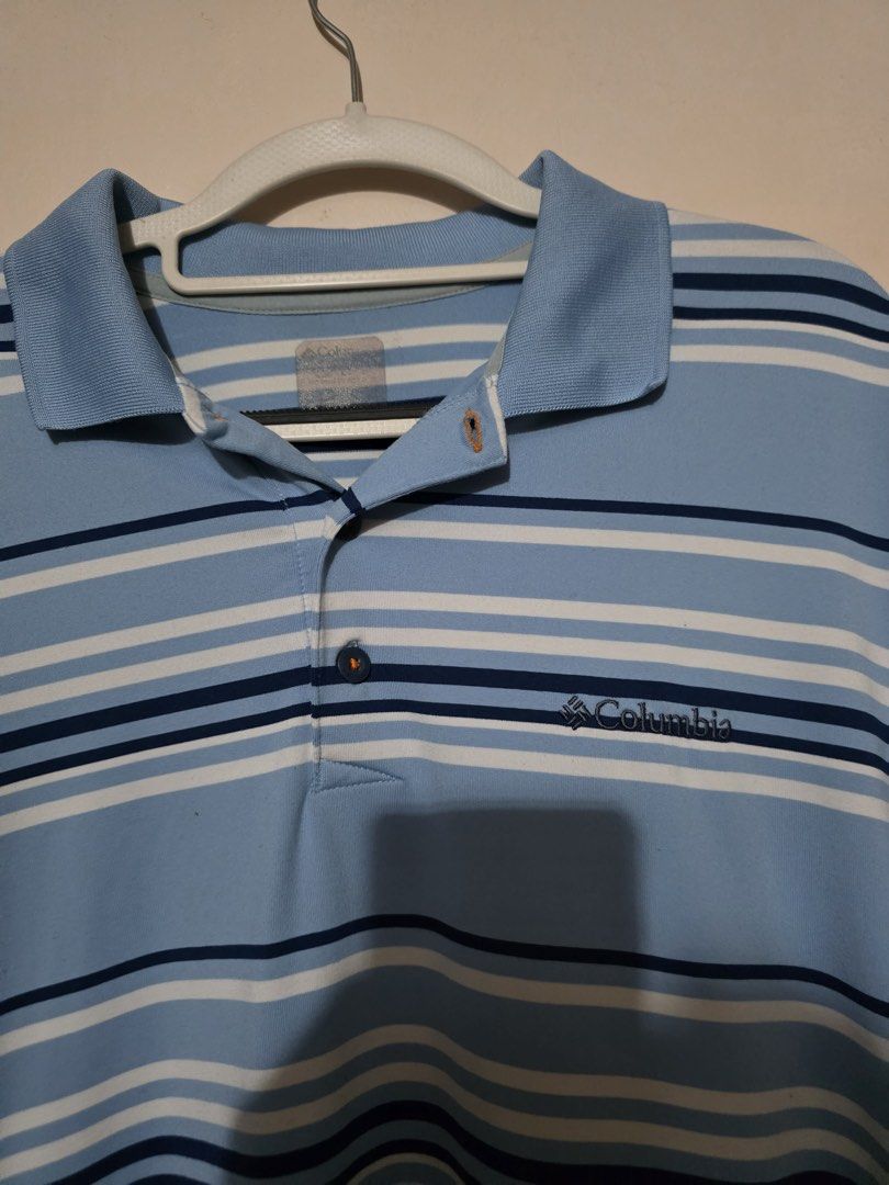 Columbia Striped Polo Shirt (Category: Tshirts & Polo Shirts ) located in San Fernando. Submitted by bizarrethrifting (Listing ID 1434199976, Image 3). Description: - Columbia polo shirt - Light blue with horizontal stripes - Collared neckline - Short sleeves - Columbia logo on chest - Button-up placket - Regular fit.
